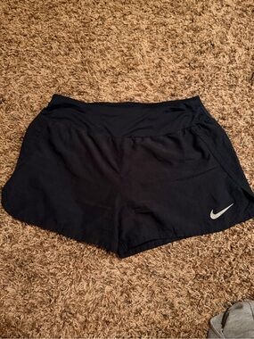 Nike Women's Black Athletic Running Shorts with White Swoosh